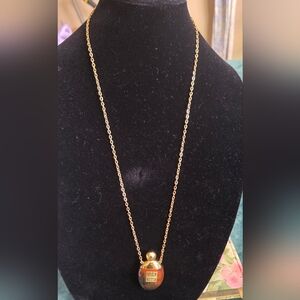 Givenchy Vintage 1977 Brown and Gold Perfume Bottle Necklace.